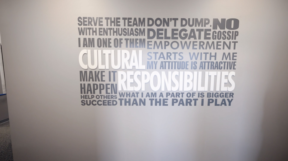 word cloud mural in the offices of henderson services in louisville kentucky company standards and values teamwork
